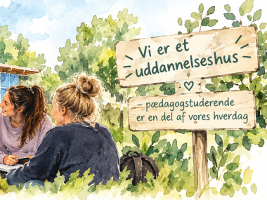 studerende sidder på græs foran Humlebien